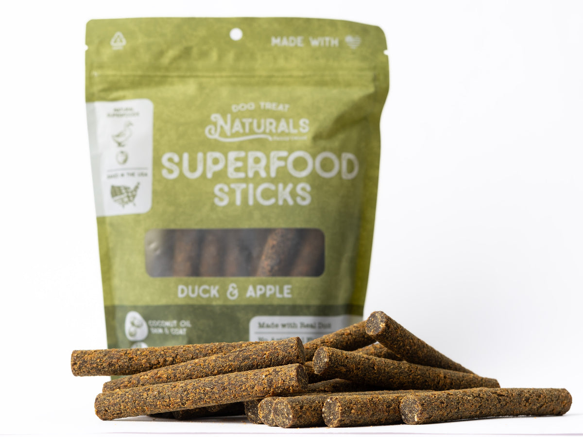 Duck & Apple Superfood Sticks bag with the treats out in front of it
