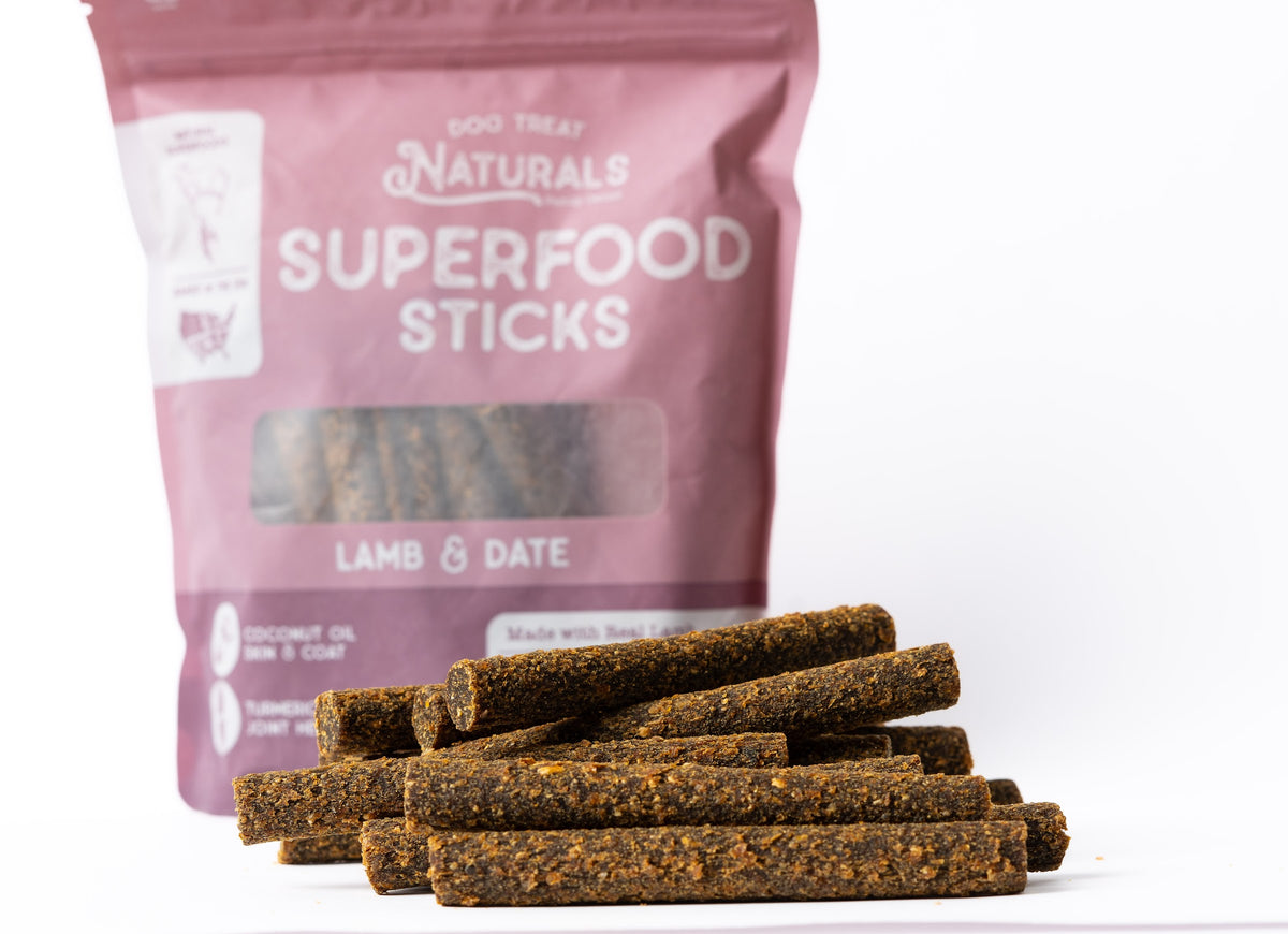 Lamb & Date Superfood Sticks bag with the treats out in front of it