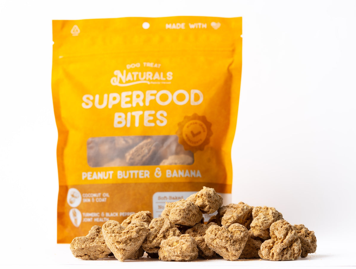 Peanut Butter & Banana Superfood Bites bag with the treats out in front of it