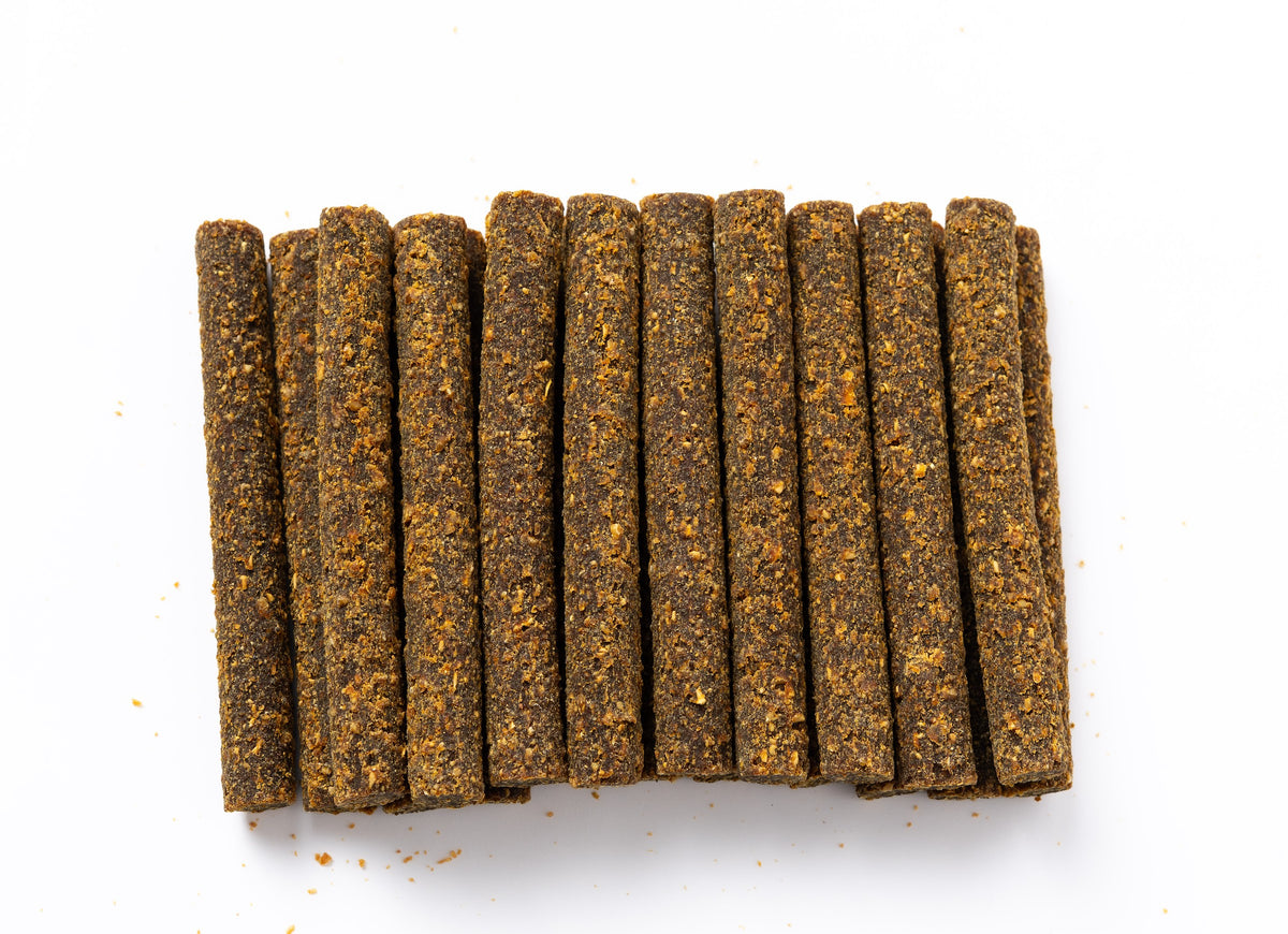 Close-up of Pork & Peach Superfood Sticks showing the real texture