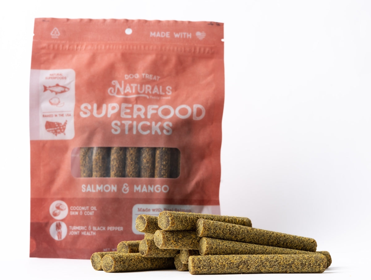 Salmon & Mango Superfood Sticks bag with the treats out in front of it