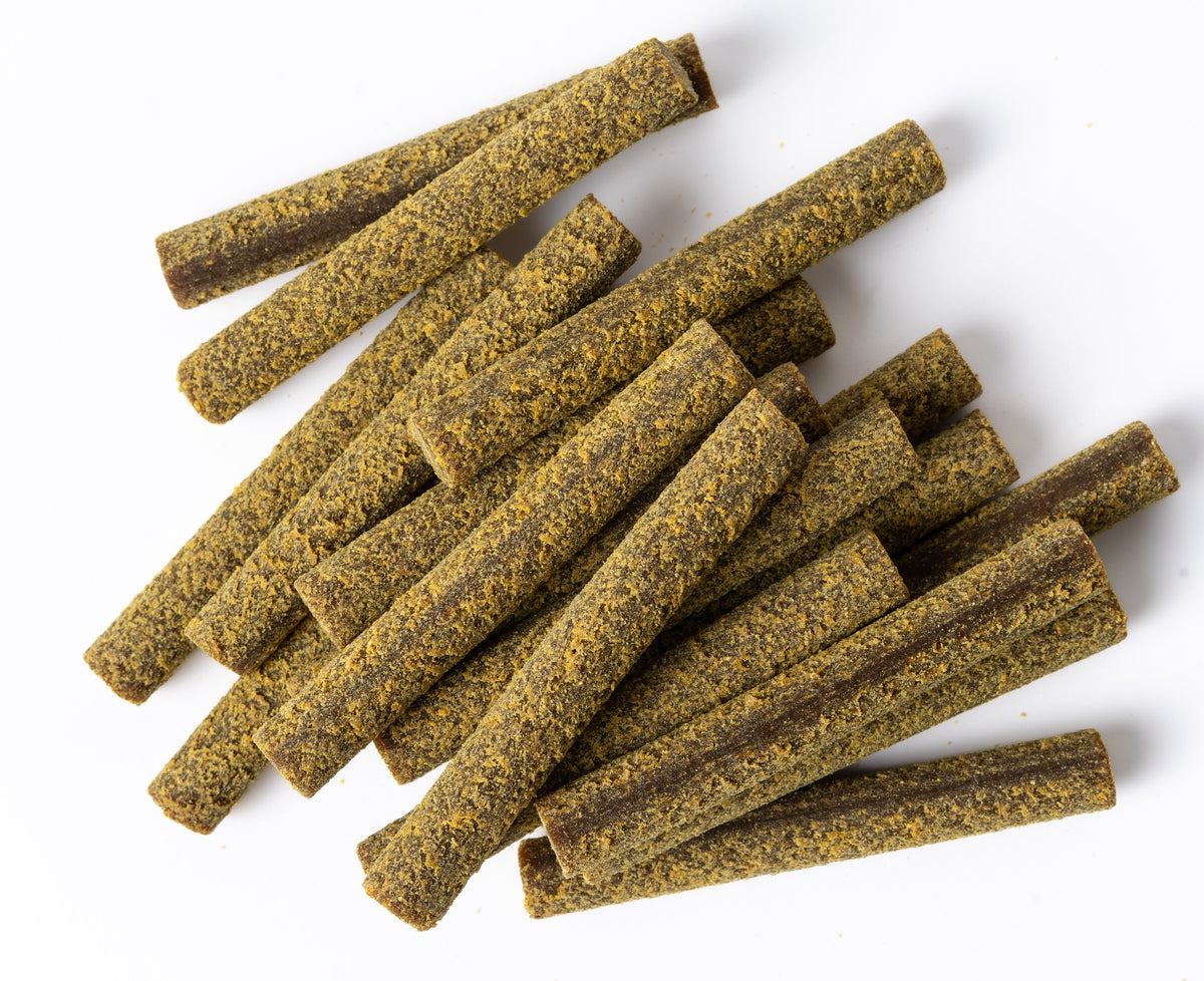 Close-up of Salmon & Mango Superfood Sticks showing the real texture